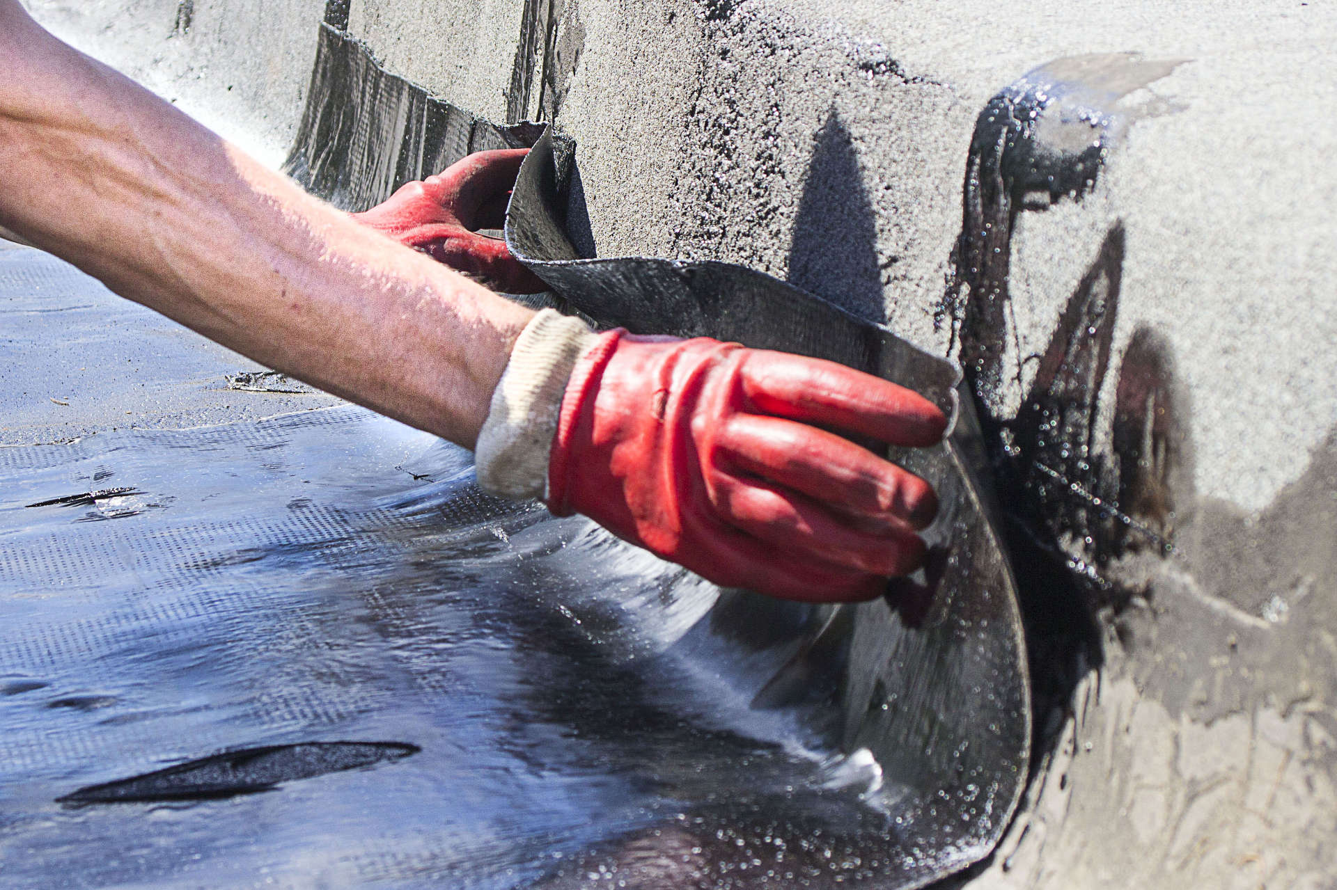 man doing foundation waterproofing